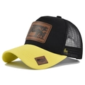 Detail of black trucker hat with mesh back, cow leather patch, and yellow brim contrast - Adjustable / Yellow Black Patchwork