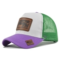 Detail of green mesh trucker hat featuring purple canvas brim and a cow leather patch - Adjustable / Purple and White