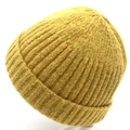 Macro shot of yellow ribbed knit beanie showing soft texture and folded cuff detail - Yellow