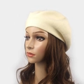 Detail of beige knit wool beret showing premium fine-knit texture and soft warm fabric - M (56-58cm) / Beige