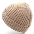 Detailed ribbed texture of a soft khaki knitted beanie hat for winter warmth - Beige