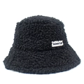 Detail of black teddy wool bucket hat showing thick lamb velvet texture and woven label - Black