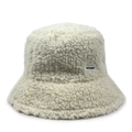 Detailed macro view of cream faux fur fabric texture and logo label on winter bucket hat - One Size / Off White
