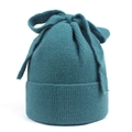 Detail of teal knit beanie featuring a large decorative bow and ribbed texture - M (56-58cm) / Lake Blue