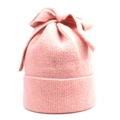 Detailed texture of pink knitted beanie with a soft finish and oversized bow ornament - M (56-58cm) / Pink