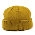 Close-up of mustard yellow knitted beanie featuring distressed ripped detailing and ribbed texture - Yellow