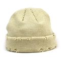 Trendy beige ribbed knit beanie with distressed hole details for a winter street style look - Beige