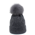 Warm dark grey knitted winter beanie for women featuring a large fluffy faux fur pompom - One Size / Dark Gray