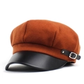 Detail of burnt orange wool baker boy hat with black leather brim and metal buckle - M / Caramel color