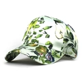 Detailed view of the fruit print fabric and satin finish on the curved baseball cap brim - Fruit Botanical Print / Green