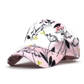 Detailed view of pink satin baseball cap featuring intricate black floral line art print - Pink