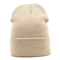 Detail of beige ribbed knit beanie showing high-quality vertical texture and folded cuff - One Size / Beige
