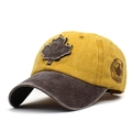 Close-up of yellow washed cotton baseball cap with maple leaf patch and Canada embroidery - Adjustable / Yellow and Coffee