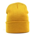 Macro shot of ginger yellow ribbed knit beanie showing fine texture and cuffed design - One Size / Gold Yellow