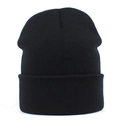Close-up of black ribbed knit beanie showing high-quality elastic fabric texture - One Size / Black