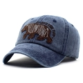 Detail of embroidered bear patch and Yellowstone text on washed blue denim baseball cap - Adjustable / Navy Blue