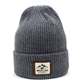 Detailed view of dark grey ribbed knit beanie featuring a wild life mountain patch - Dark Gray