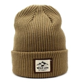 Close-up of khaki ribbed knit beanie featuring a vintage Wild Life adventure patch - Khaki