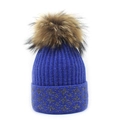 Close-up of blue ribbed knit beanie with a fluffy brown faux fur pompom and silver stars - M (56-58cm) / Sapphire Blue