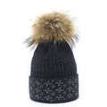 Close-up of black knit beanie with silver tinsel details and fluffy faux fur pom-pom - M (56-58cm) / Black