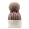 Detailed close-up of pink knit winter hat with white cuff and large fluffy pompom top - M (56-58cm) / Pink + White