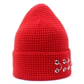 Detail of red knitted beanie featuring silver metal rings on ribbed cuff streetwear style - Red