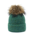 Close-up of deep green cable knit winter beanie with a fluffy raccoon fur pom-pom - M (56-58cm) / Green