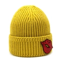 Close-up of bright yellow knit beanie featuring a sequined red lip embroidery patch - Yellow