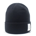 Close-up of black knit beanie with white Love Pet logo tag and metal D-ring detail - One Size / Black