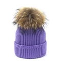 Detailed view of dark purple knit beanie with large genuine raccoon fur pom pom - Purple / One Size