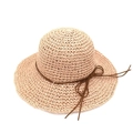 Detail of raffia straw sun hat featuring a brown string bow and textured weave pattern - M (56-58cm) / Pink