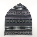 Detail of winter knit beanie showing Nordic geometric patterns and soft texture - Gray