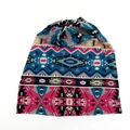 Detail showing the intricate ethnic geometric knit pattern on a multi-use beanie scarf - Multicolor Ethnic Print