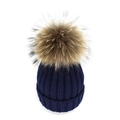 Macro detail of navy blue ribbed knit texture and large faux fur pompom on beanie - Navy Blue
