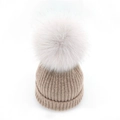 Minimalist light khaki knitted beanie with large fluffy faux fur pom-pom for winter warmth - Champagne