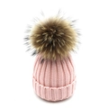 Detailed texture of pink ribbed knit beanie featuring a large fluffy faux fur pom-pom - Lined Adult Style / Pink