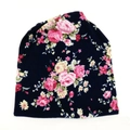 Slouchy beanie for women featuring pink floral rose print on a dark navy knit fabric - Dark Blue Floral Rose (1)