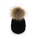Close-up of black ribbed knit beanie featuring a fluffy natural raccoon fur pompom detail - Black