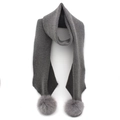 Detail view of dark grey ribbed knit scarf featuring fluffy fox fur pom-poms on both ends - 200cmx25cm / Gray