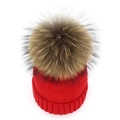 Detailed top view of red knitted beanie featuring a large 15cm brown faux fur pompom - Red