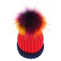Winter knitted beanie for women featuring a large colorful pompom and navy folded brim - Red + Navy Blue