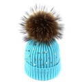 Detail of light blue knit hat with white pearls, metal studs, and a fluffy fur pom-pom - Sky Blue