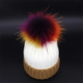 Close-up of knit white beanie with brown ribbed cuff and a colorful large pom-pom detail - Adult / White + Coffee