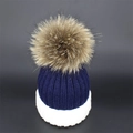 Winter knitted beanie for women featuring navy and white contrast with a fluffy fur pompom - Navy Blue + White