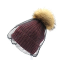 Women's burgundy knit wool beanie with yellow fur pom-pom and black mesh veil overlay - Red