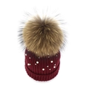 Detail of burgundy knit beanie with white pearls and large natural fur pompom decoration - Burgundy