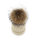Detailed close-up of beige knit beanie featuring white pearls and a fluffy fur pom-pom - Beige