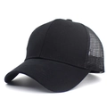 Detail view of black mesh trucker hat with breathable fabric and curved sun visor brim - Adjustable / Black