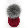 Winter knitted beanie in wine red with a large silver fox fur pom-pom on white background - Children Style / Burgundy