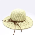 Detail of hand-woven straw sun hat showing hollow mesh brim and brown leather bow ribbon - M(56-58cm) / Cream